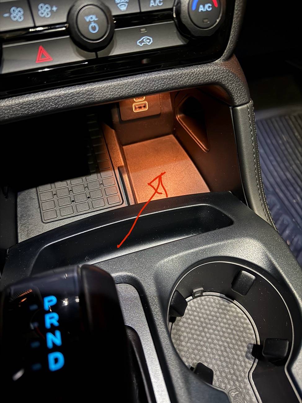 Ford Ranger Rubber mat in storage near wireless charger IMG_1093
