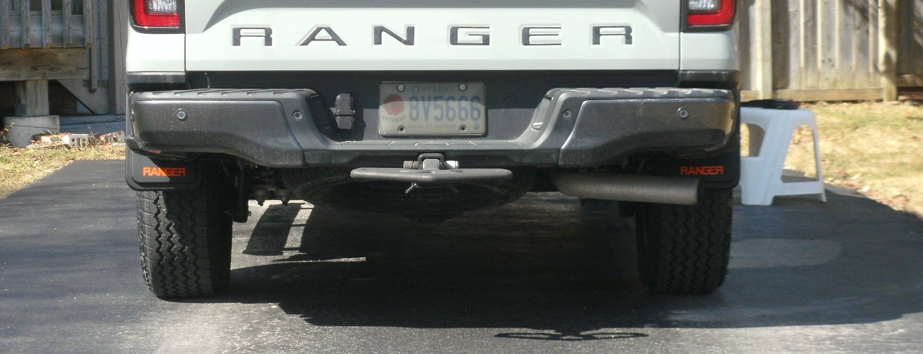 Ford Ranger Axle dump exhaust exit for rear side step clearance Mudflaps rear view.JPG