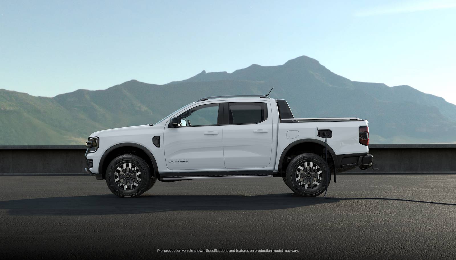 Ford Ranger 2025 Ranger PHEV Hybrid Revealed w/ Pro Power Onboard, 28 Miles Range, Arriving Early 2025 (Europe/AUS) P703_PHEV - Side View Static - RHD Standard - CHARGING