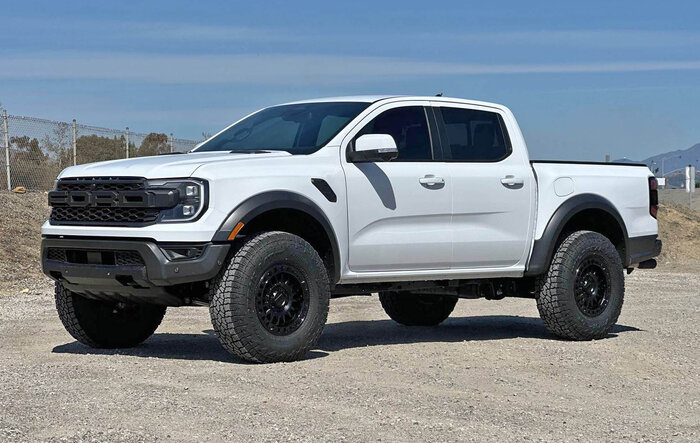 FMI 2" Collars + Falken Wildpeak AT4 35/11.50/17 on 17x8.5 +25 offset KMC KM552 Wheels