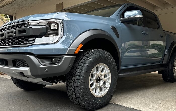 285/75/R17 Toyo Open Country A/T III (34") tires with +25mm KMC Hatchet Wheels Installed on Ranger Raptor